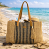 Enrico Benetti strandtas beige‑zwart van geweven raffia met leren hengsels en kwastje
